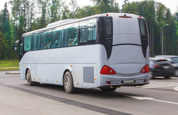 istock tourist bus goes on asphalted highway 1130996398