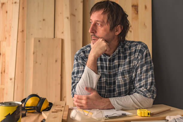 istock Carpenter thinking in small business woodwork workshop 1130996950