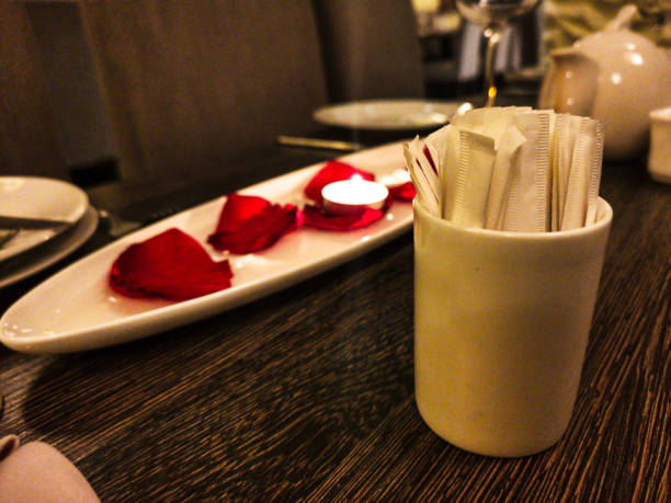 Pieces of tissue paper set on the table with sachets of toothpick