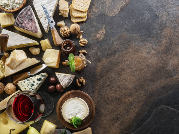 istock Cheese platter with organic cheeses, fruits, nuts and wine. 1131001433