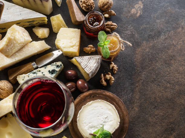 istock Cheese platter with organic cheeses, fruits, nuts and wine. 1131001508