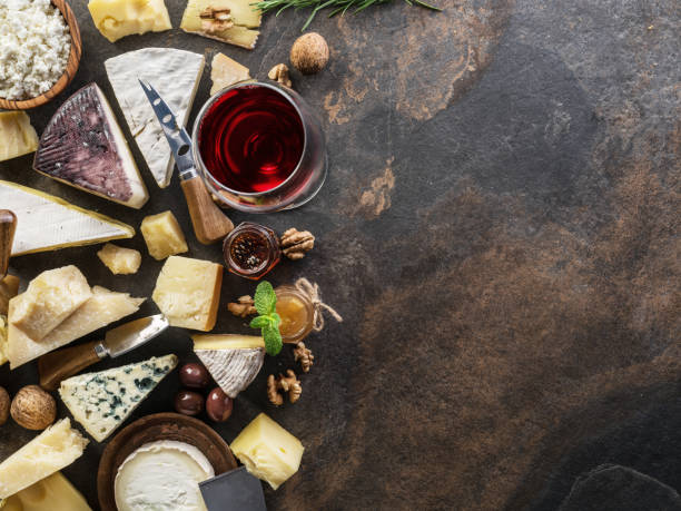 istock Cheese platter with organic cheeses, fruits, nuts and wine. 1131001684