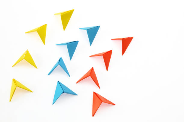 istock arrow formed origami in a white background 1131003086