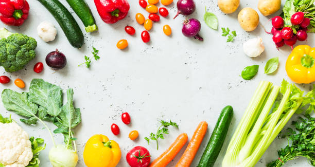 Kitchen - fresh colorful organic vegetables on worktop Kitchen - fresh colorful organic vegetables captured from above (top view, flat lay). Grey stone worktop as background. Layout with free text (copy) space. freshness stock pictures, royalty-free photos & images