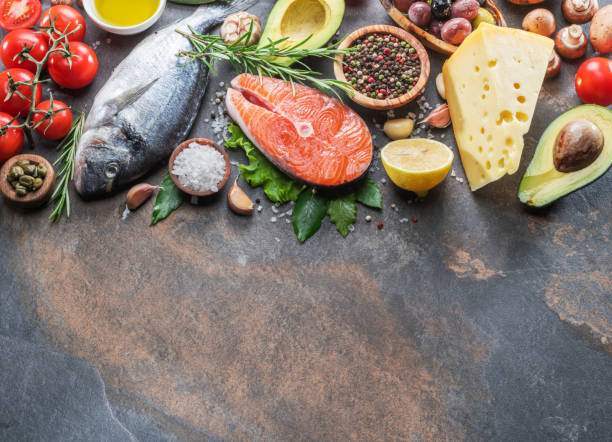 istock Raw dorado fish and salmon steak with spices and vegetables. 1131005589