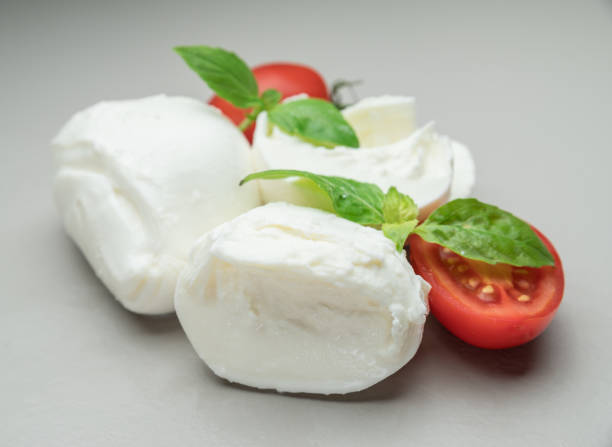 istock Traditional Italian mozzarella cheese with herbs and tomatoes. 1131006964