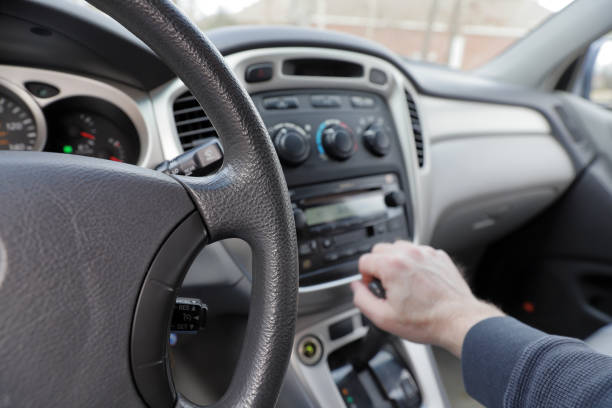 istock Hand on car Gear Shift, with view of climate controls and dashboard 1131008892