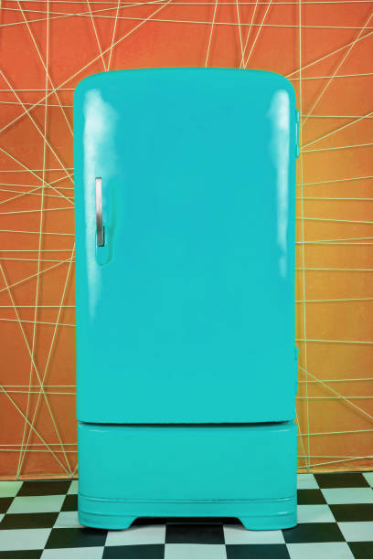 istock old vintage blue refrigerator on a orange background 1131009329