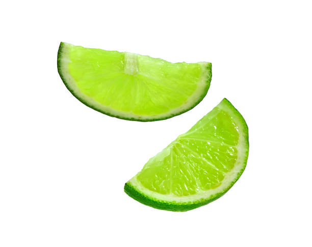 istock Lime slice. Juicy slice of lime isolated 1131010023