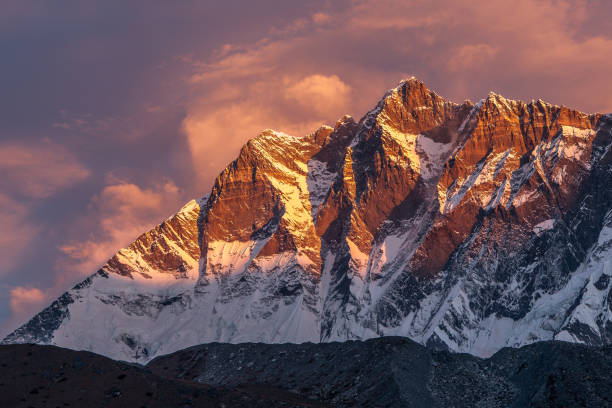 istock Beautiful sunset with pinkish clouds over Himalayan mountains. 1131010378