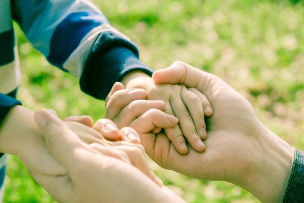 istock hand child mother son boy. small. 1131010598