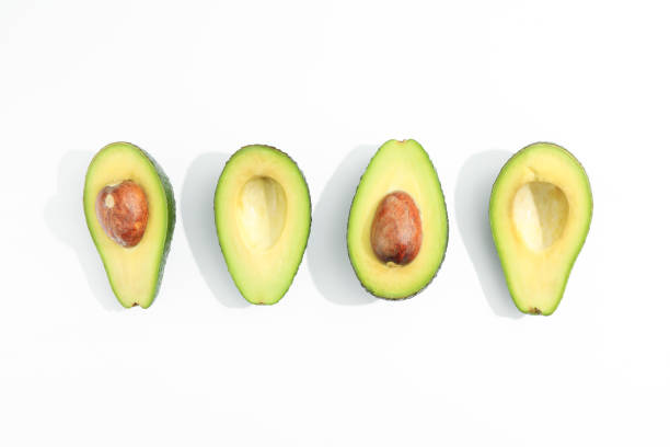 istock Flat lay composition with ripe avocados on white background, space for text. Top view 1131013428