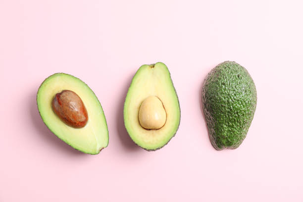 istock Flat lay composition with ripe avocados on color background, space for text. Top view 1131013596