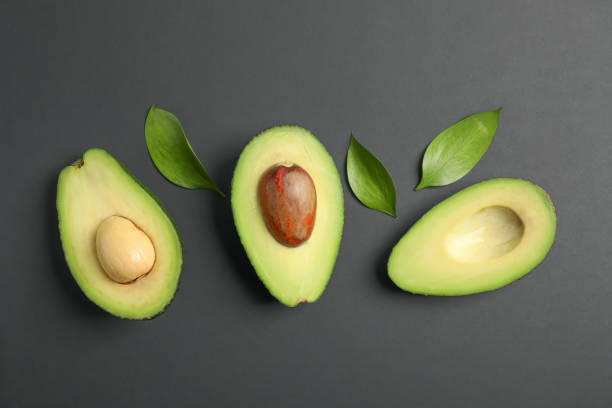 istock Flat lay composition with ripe avocados on black background, space for text. Top view 1131013628