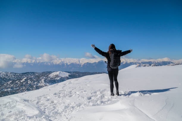 istock Young Woman relaxing at snow field 1131020770