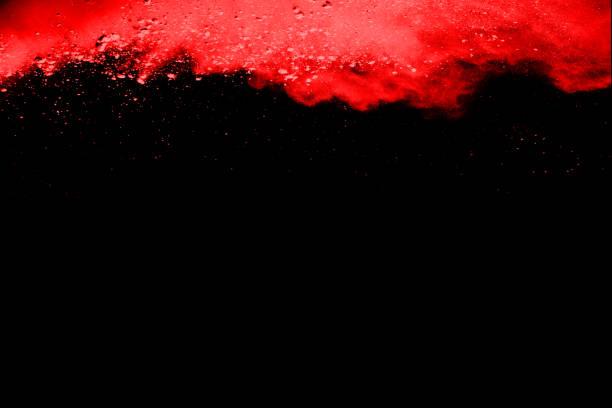 istock abstract red powder explosion on black background.abstract red powder splatted on black background. Freeze motion of red powder exploding. 1131021875