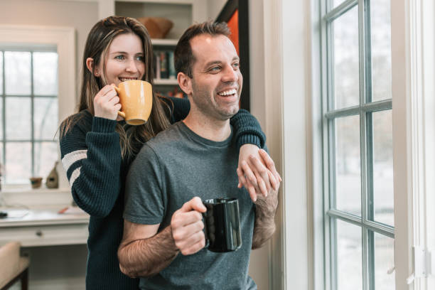 istock Couple having coffee in front of window 1131022424
