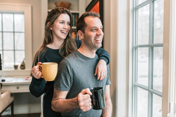 istock Couple having coffee in front of window 1131022444