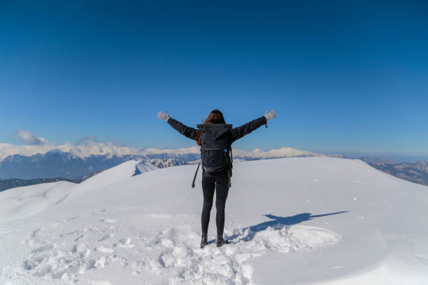 istock Young Woman relaxing at snow field 1131022784