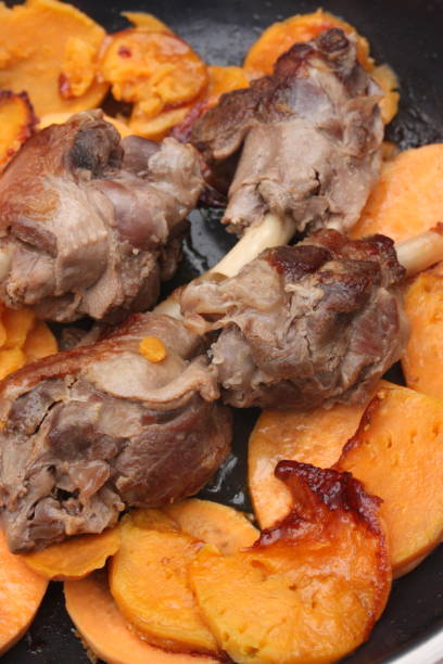 istock Confit duck legs roasted with sweet potatoes 1131025057