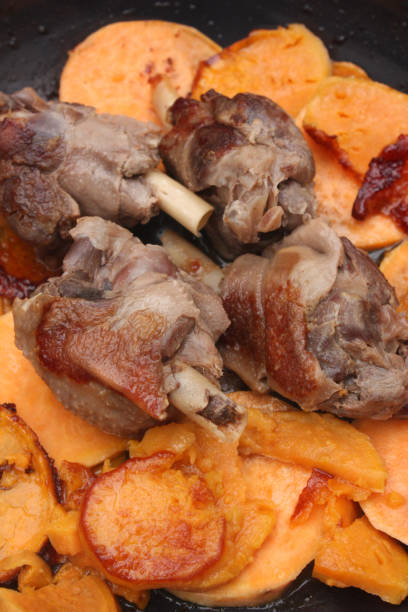 istock Confit duck legs roasted with sweet potatoes 1131025059