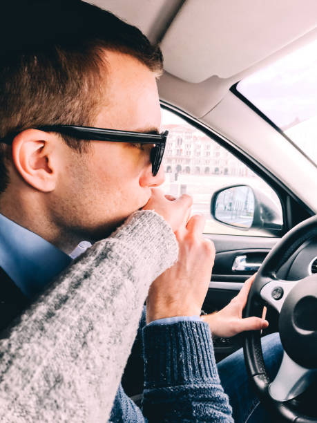 istock Young Couple in Car on the Move 1131026410