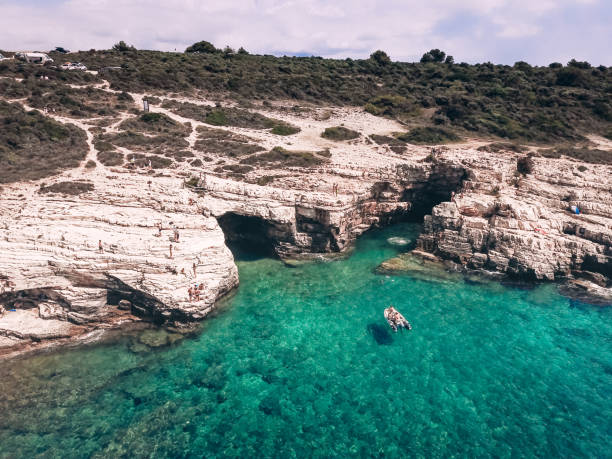 istock People Exploring Coastline With Rubber Boat 1131026616