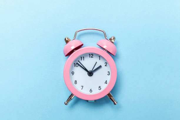istock Vintage alarm clock Isolated on blue pastel background 1131026669