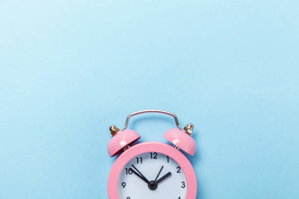 istock Vintage alarm clock Isolated on blue pastel background 1131026675