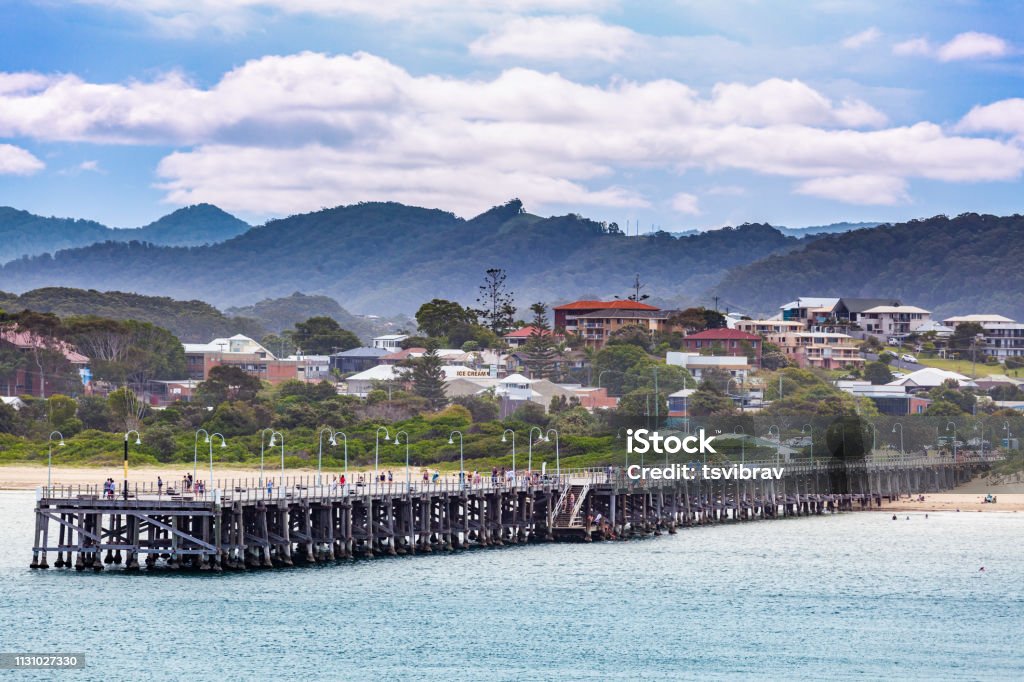 People walking on Coffs Harbour Jetty Coffs Harbour Stock Photo