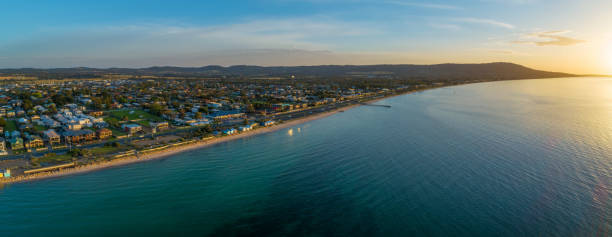 istock Safety Beach suburb coastline at sunset. Aerial panorama with copy space 1131027439