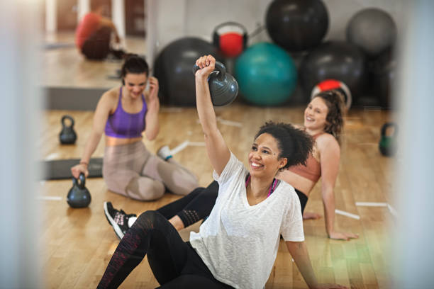 istock Group of young people  exercising at the gym 1131027571