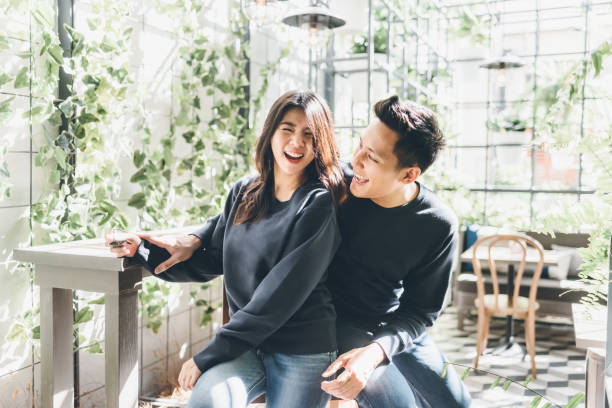Happy Asian couple in love having fun