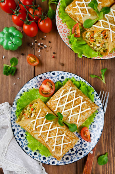 istock Crepes stuffed with stewed cabbage with carrots and eggs. 1131030622