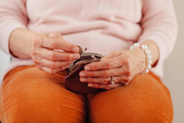 istock Senior Women Holding Money 1131033670