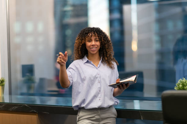 istock Confident business woman presents at a workshop 1131035770