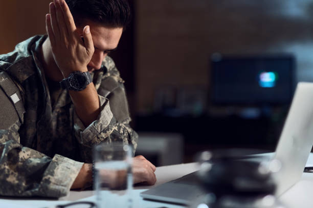 istock Upset military officer crying while having video call on laptop. 1131037730