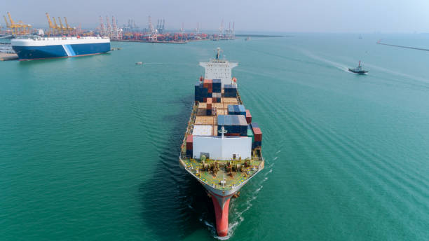 istock Container ship at sea port for logistic, import export, shipping or transportation. 1131038013