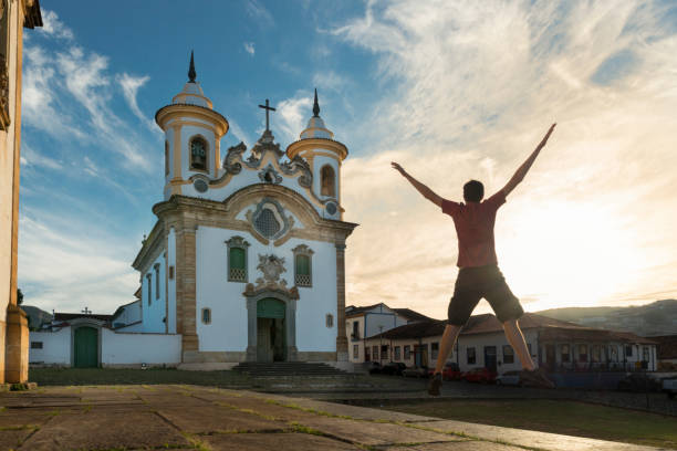 istock Man jumping in front of a Baroque Rococo Church Mariana 1131043117