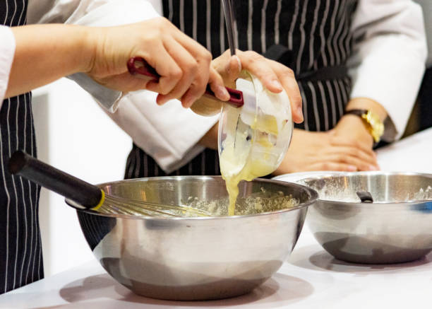 istock chef making dough on kitchen, Mixing Butter Milk Pastry Bakery, cook and cake 1131046402