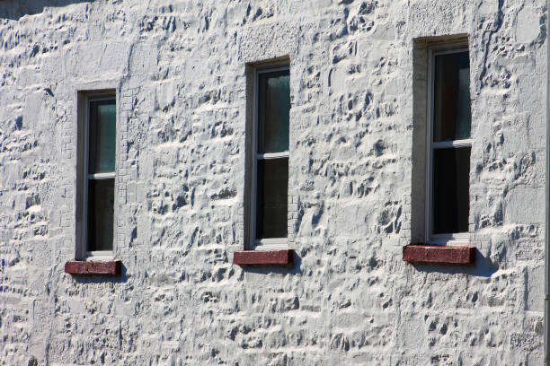 istock Three windows in the stonewall of an old building 1131046403
