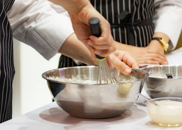istock chef making dough on kitchen, Mixing Butter Milk Pastry Bakery, cook and cake 1131046406