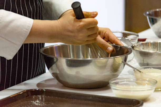 istock chef making dough on kitchen, Mixing Butter Milk Pastry Bakery, cook and cake 1131046408