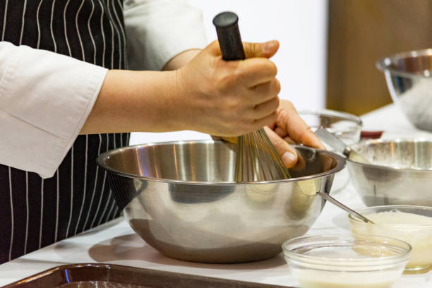istock chef making dough on kitchen, Mixing Butter Milk Pastry Bakery, cook and cake 1131046411