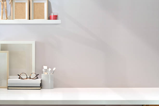 istock Contemporary minimal workspace with white wooden table and copy space 1131047920
