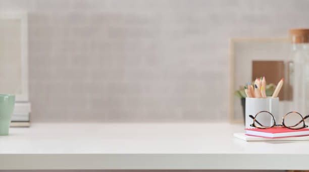 istock Contemporary workspace with white wooden table and copy space 1131047952