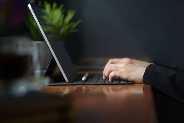 istock Woman working with tablet in cafe 1131048116