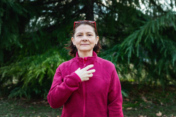 istock Woman using American sign language - hand gesture, term hungry 1131048788