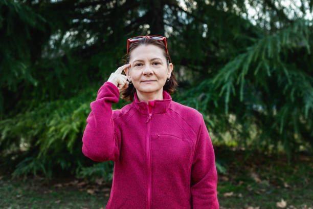 istock Woman using American sign language - hand gesture, term know, knowing 1131048887