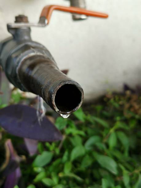 istock Water drop and old faucet 1131049787